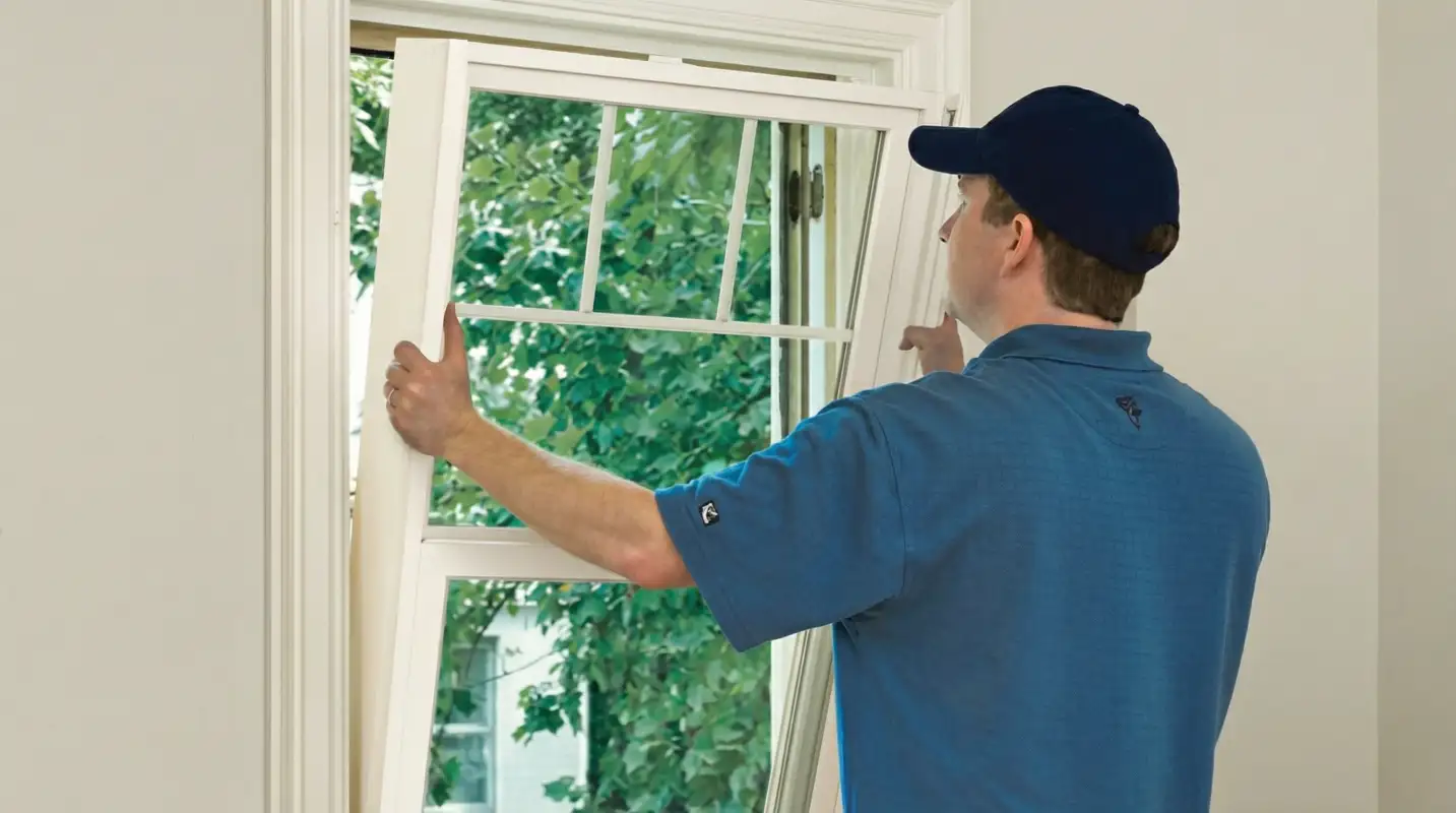 Professional contractors performing a residential window insulation and replacement service in Glendale, AZ